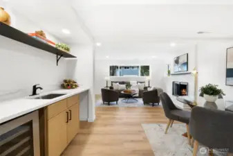 Downstairs wet bar with mini fridge and wine cooler.