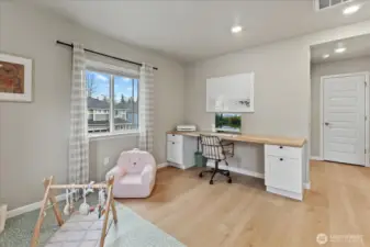 Spacious Loft with Custom Cabinets and Woodblock Desk