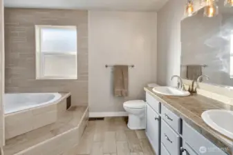 Enjoy the Master Bathroom's Dual Sinks and Soaking Tub, ideal for a spa-like Experience!