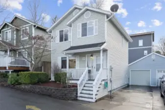 Front of home with detached 1-car garage