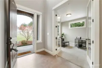 Light and bright entry leads into private office with glass French doors