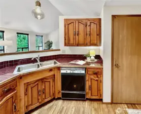 Another kitchen view shows pantry and view into great room.