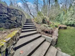 View of steps and rockeries. lots of room to garden.