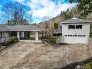 Lower portion of circular driveway, 2-car garage and lots of off-street parking.