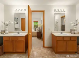 Second Primary Suite attached Bathroom with double vanities provide ample storage and space.