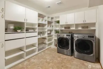 HUGE Laundry Room/Mud Room on the Main Level, plenty of room for Costco supplies! Washer,  Dryer and Garage refrigerator stay with the home.