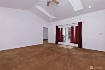 Large Living room with French doors leading out to a beautiful deck.