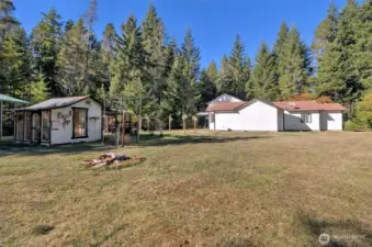 Beautiful flat, fully-usable acre. Cool little work shop to the left.