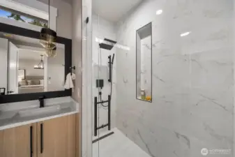 A beautifully designed shower in the primary bath.