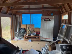 Entry door and two exterior window on site ready to install in cabin #2