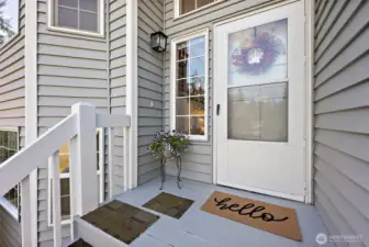 Entry into house at top of front porch stairs