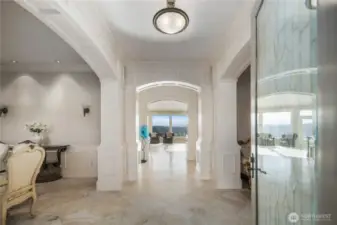Timeless interior finishes including Italian travertine flooring and soaring 10' ceilings.