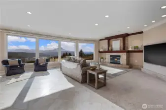 Expansive great room with statement fireplace and breathtaking views