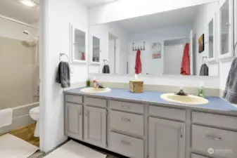 Located between the 2 bedrooms, this full bath has been updated. Freshly painted gray cabinets!