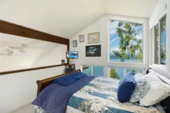 Upper-level loft primary bedroom