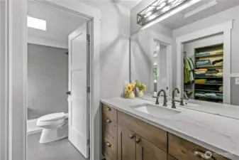 Matching cabinets/quartz counter tops and tile just finished in shower.