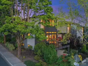 Situated on the corner of Market Street, this stunning 3-level home is enveloped by lush landscaping that enhances its curb appeal and creates a private, serene oasis.