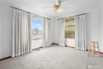 Living room with hardwood floors under carpet