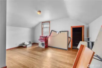 Upstairs bedroom with hardwoods