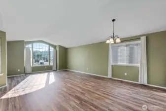 This large space is the living room/dining area combination. Attractive solid surface flooring is throughout the living spaces int he home, with carpet in the bedrooms.