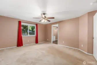 Large window in the primary bedroom for natural light.