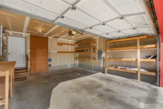 The garage features lots of shelf space.