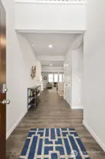 Vaulted entry impresses and provides more light. Photo is representational. Actual home is under construction and finishes and paint colors may vary. See site agent for details.