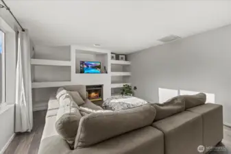 Make the space cozy with sectional and relax by the fireplace!