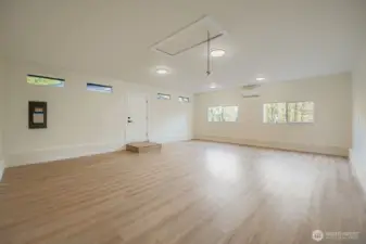 Open studio room with mini-split.