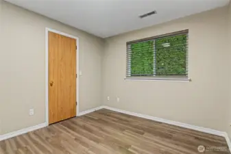 The door is the walk in closet for the first bed room.