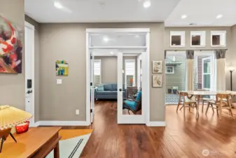 Guest suite with French doors includes custom window shades, for optimal privacy.